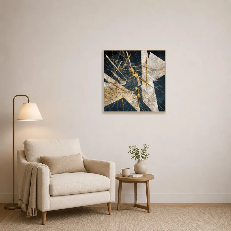 A golden abstract print brightens a cozy reading corner with a comfortable chair.