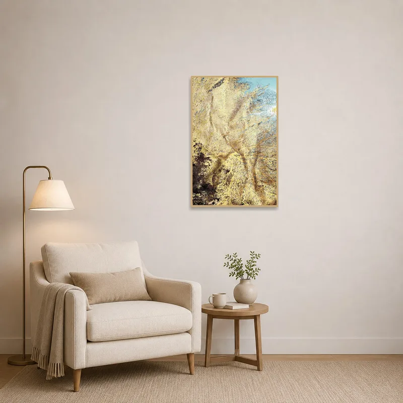 Golden abstract art adding elegance to a cozy reading corner.