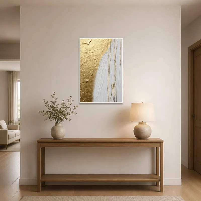 Entrance hall adorned with golden and white abstract artwork on a clean wall.