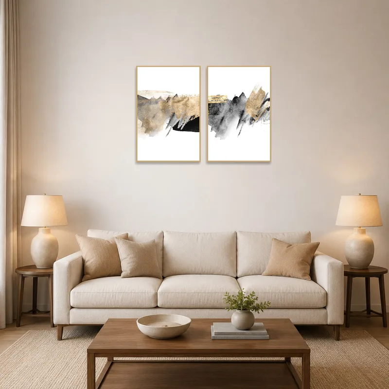 Golden brushed abstract art set on a living room wall above a modern sofa.