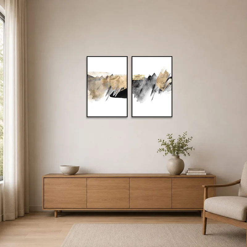 Abstract art set hanging in a minimalist room with sleek white walls and simple furniture.