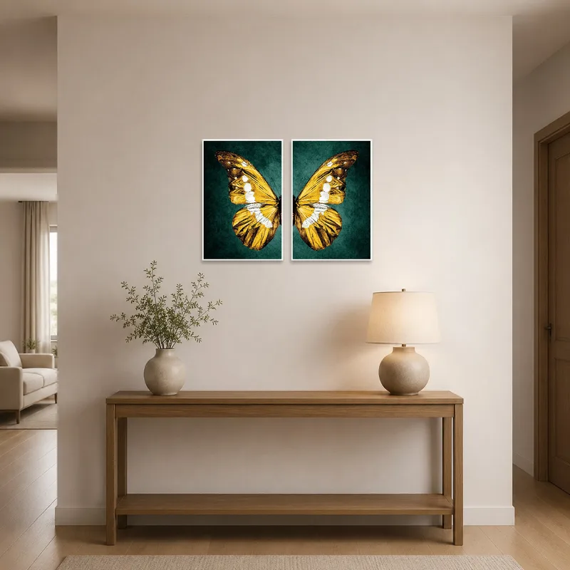Entrance hall adorned with golden butterfly wing art set above a narrow console table.