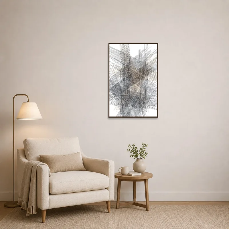 Geometry art hanging in a cozy reading corner with a comfy chair and books.