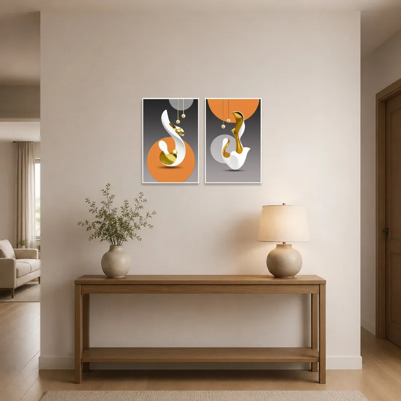 Abstract prints with gold accents add flair to the entrance hall, greeting guests with a contemporary visual.