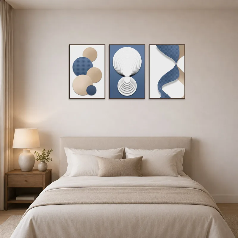 Set of geometric artworks accentuating the serene ambiance of a bedroom.