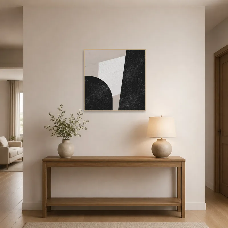 A stylish entrance hall showcases a monochrome geometric abstract art print welcoming guests.