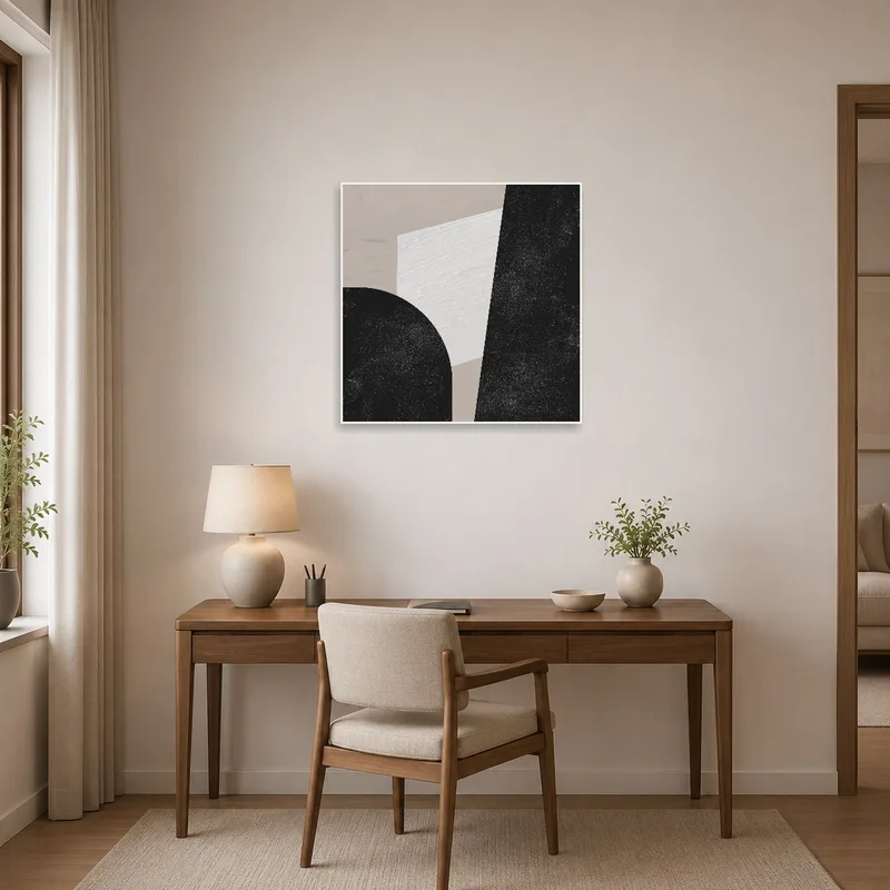 The home office is energized with a monochrome geometric abstract art print on the wall.