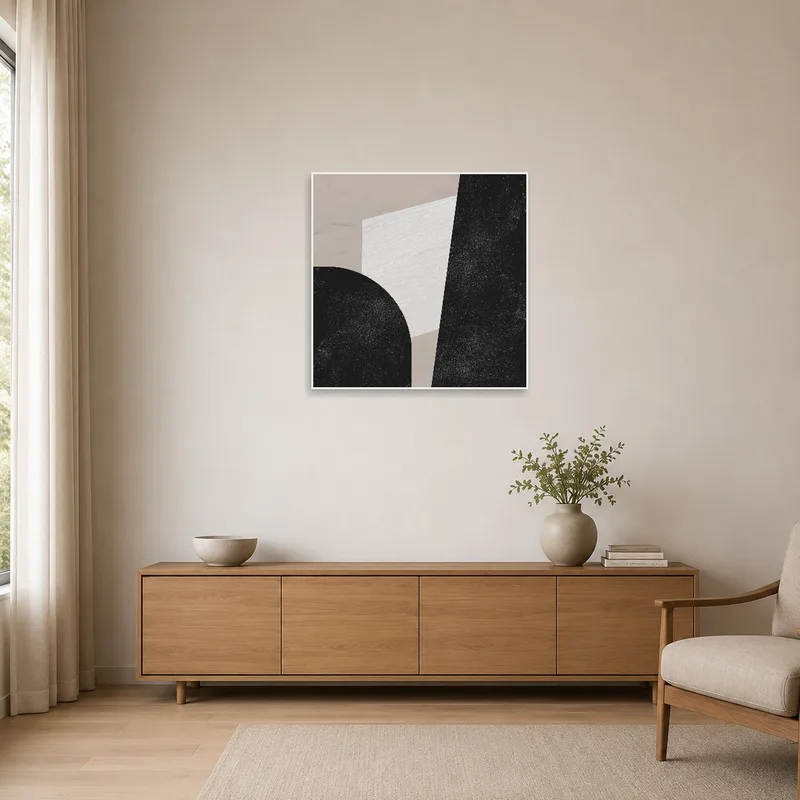 The minimalist room features a sleek monochrome geometric abstract art print on a crisp white wall.
