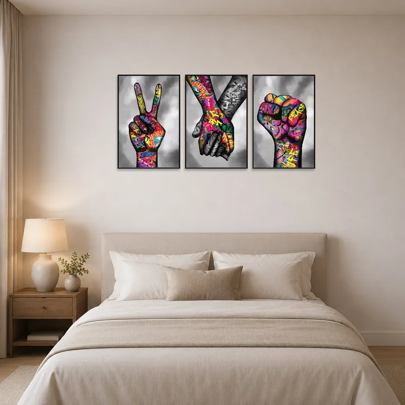 Street art triptych enlivening a chic bedroom above the bed.