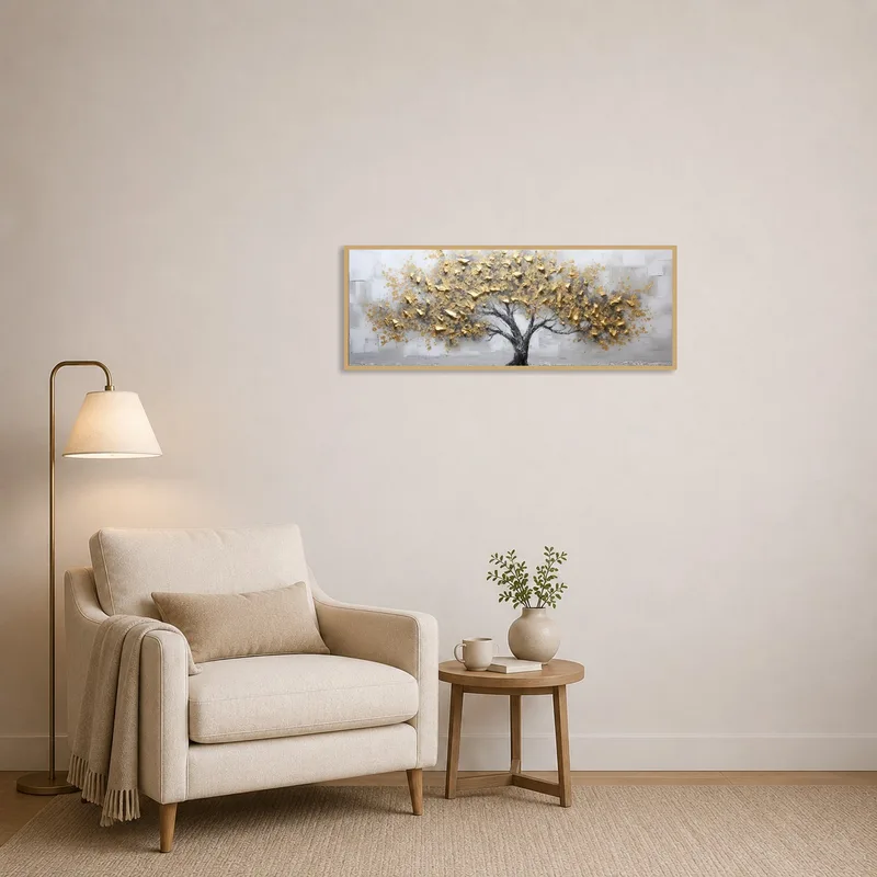 Reading corner adorned with gold leaf tree art print near a cozy chair.