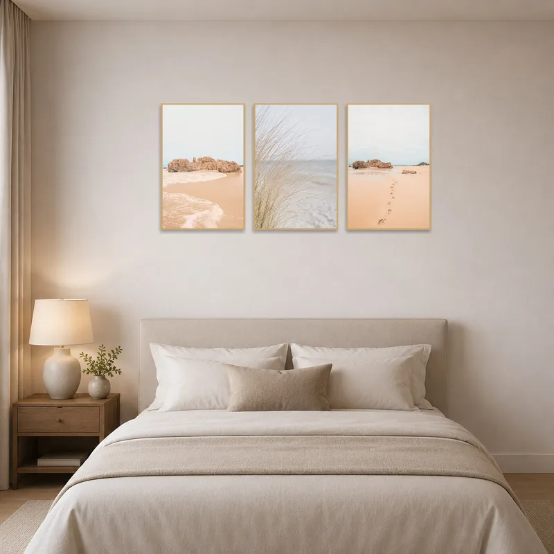Peaceful seascape trio enhancing the tranquility of the bedroom.