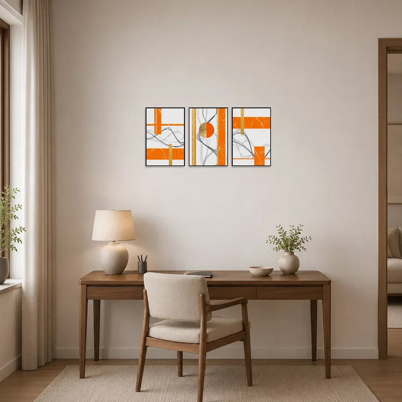 Energetic orange and gold art invigorates a home office space.